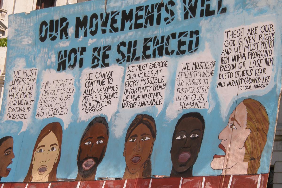 "Our movements will not be silenced" banner